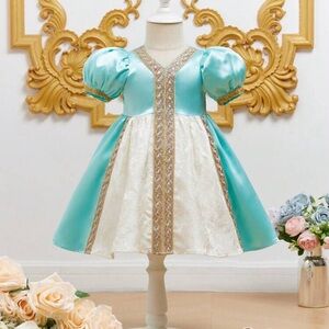 Elegant Blue and Cream Dress with Gold Accents